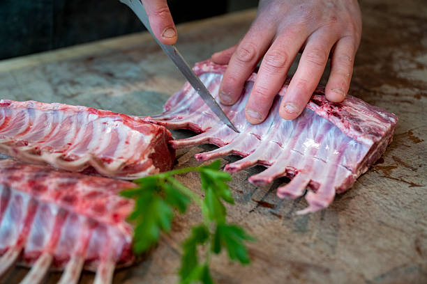 istock Butcher prepares rack of lamb 2209696890