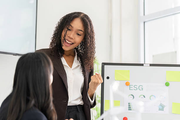 istock ESG Engagement and Team Collaboration. A speaker passionately elaborates on sustainability initiatives in a workshop setting. 2209696899