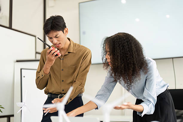 istock Collaboration and Focused Discussion on Renewables. Professionals brainstorming sustainable strategies in a modern office. 2209697559