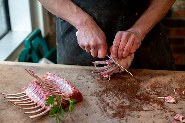 Butcher prepares rack of lamb