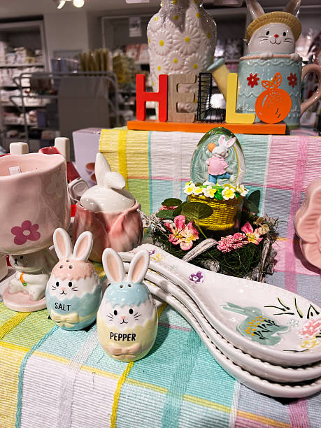 istock Easter themed decor featuring bunny salt and pepper shakers on colorful cloth 2209698007