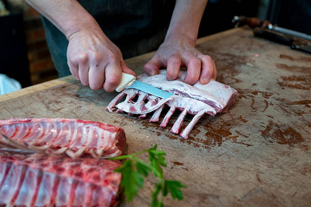istock Butcher prepares rack of lamb 2209698308
