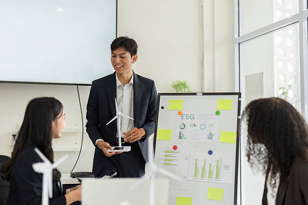 istock ESG Data Analysis and Team Engagement. Professionals analyzing sustainable growth metrics in an interactive meeting. 2209698351