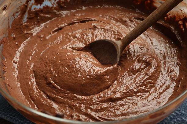 istock Chocolate dough and spoon in bowl, closeup 2209699801