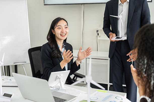 istock Exciting Brainstorming Session on ESG. A female team member expressing enthusiasm while discussing sustainable initiatives. 2209699954
