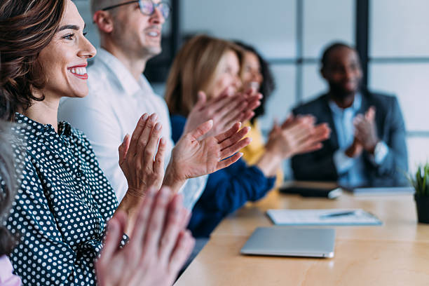 istock Businesspeople applauding during a seminar in conference hall. 2209704529