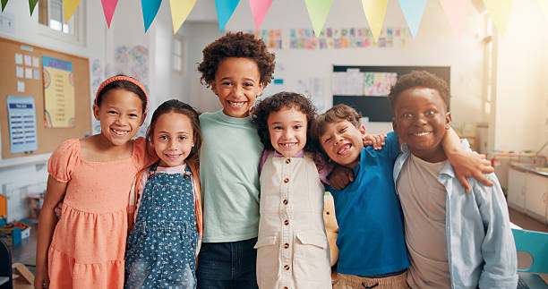 istock Portrait, education and diversity with students in classroom for child development, future and learning. Academy, growth and scholarship with group of kids in school for knowledge, lesson and study 2209704849