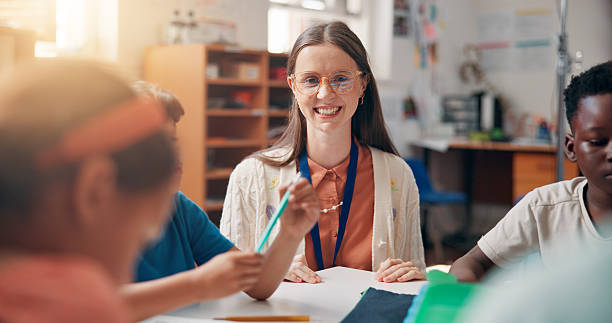 istock Education, knowledge or study with students and teacher in classroom of school for child development. Growth, learning or teaching with smile of woman and kids in lesson for academics or course 2209704927