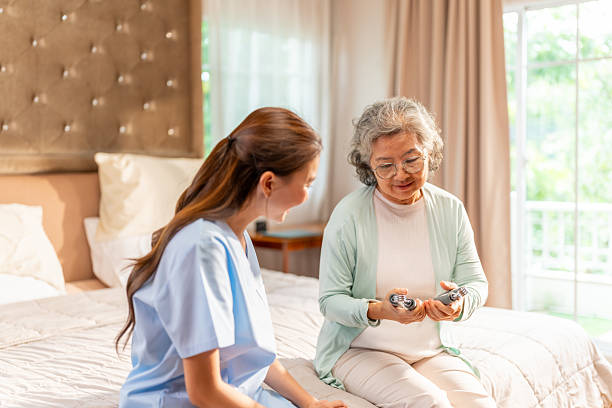 istock Doctor examine senior patient at home. 2209708733