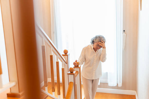 istock Asian senior woman got dizzy during walking up stairs. 2209708793