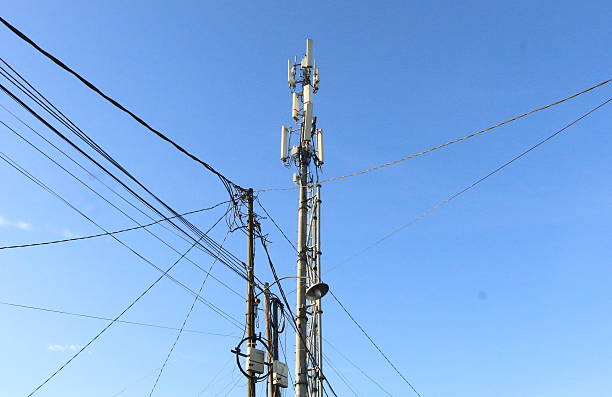 istock Base transceiver station towers and electricity poles 2209709493