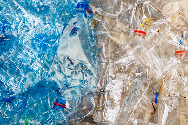 istock plastic bottles. recycling To conserve the environment concept.Background of many used empty PET bottles 2209709536