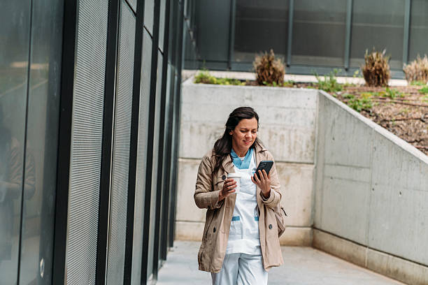 istock Nurse Enjoys Coffee Break Outside Hospital 2209711260