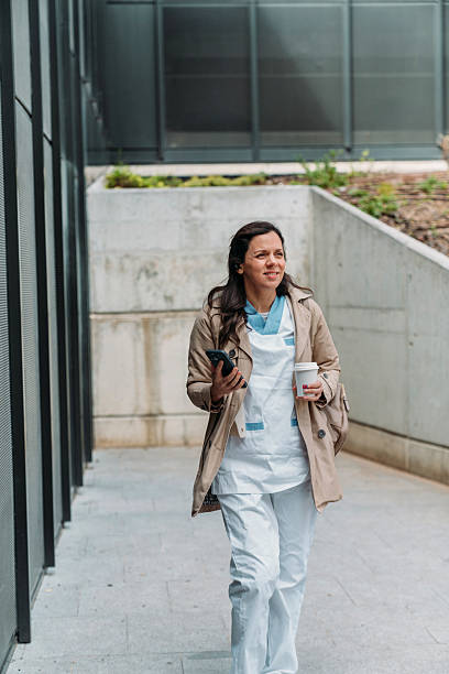 istock Nurse Enjoys Coffee Break Outside Hospital 2209711262
