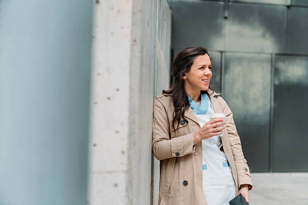 istock Nurse Enjoys Coffee Break Outside Hospital 2209711272
