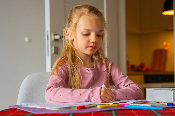 istock Young child engages in creative drawing activity at home in a cozy setting during the afternoon 2209711988