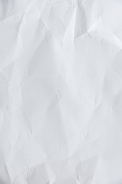 istock Crumpled paper texture crease natural background authenticity imperfection white sheet smooth matte paper unmarked symbolizing purity minimalism plain surface Paper art highlights organic fibers grain 2209716160