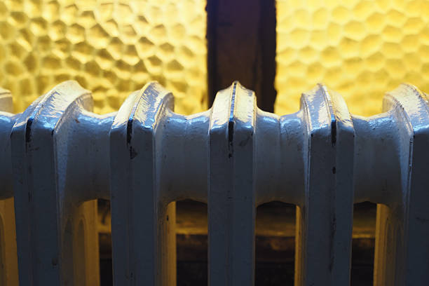 istock White radiator against a window, apartment heating installation system, 2209716364