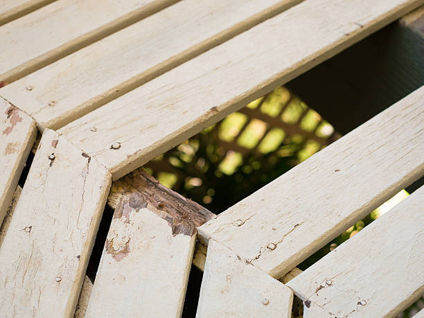 Broken park wooden bench. Consequences of vandalism