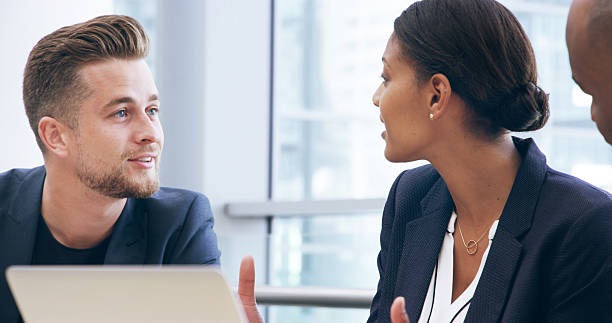 istock Discussion, business people and team in meeting for ideas, brainstorming and problem solving for insight. Collaboration, laptop and planning for investment, economy or financial project in office 2209717973