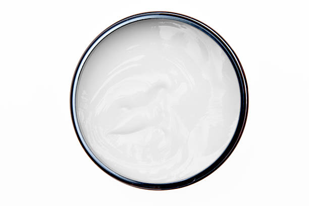 istock Cosmetic cream in a jar top view on white background 2209723318