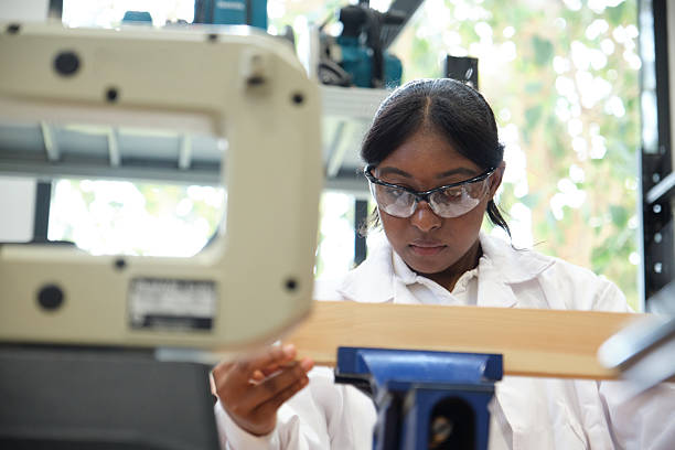 istock Young professional working with wood in a well-equipped workshop 2209723442