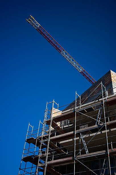 istock Steel scaffolding on a newly constructed red brick apartment block. 2209723766
