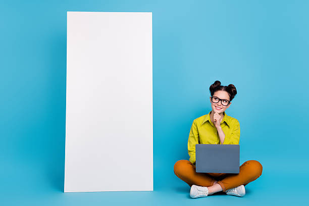 istock Full size portrait of minded lady sit floor look empty space ui panel website isolated on blue color background 2209723866