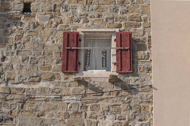 Rustic Window with Red Shutters in Piran, Slovenia