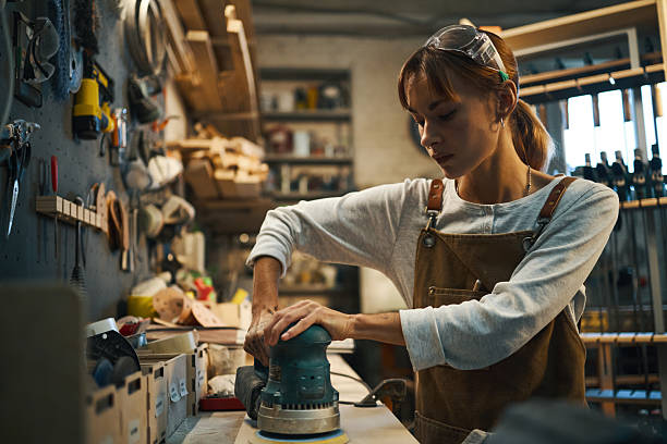 istock Woman Using Polishing Machine T 2209730710