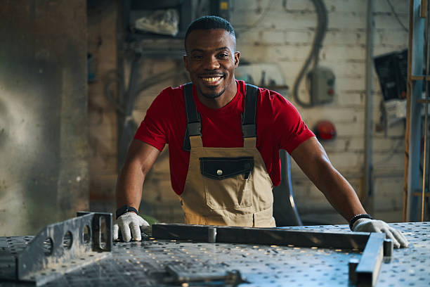 istock Worker Making Metal Frame For Sign Production 2209730844