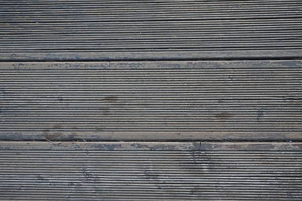 istock Weathered Wooden Deck with Grooves 2209732019