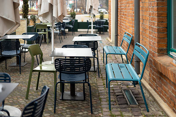 istock Outdoor cafe seating with tables and chairs 2209732819