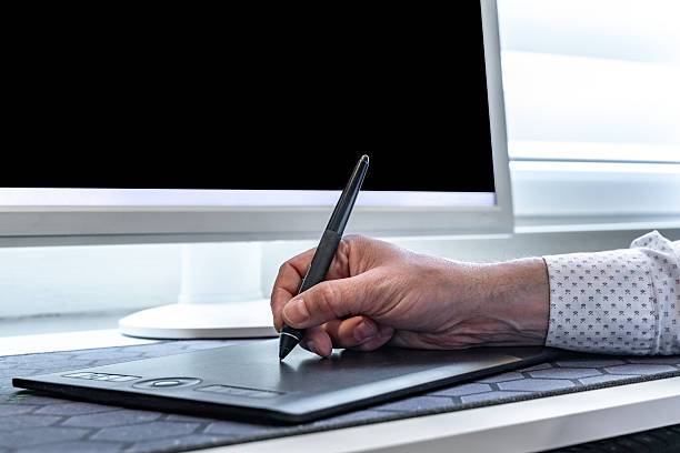 istock Man drawing with electronic pen, digital tablet with stylus 2209733507