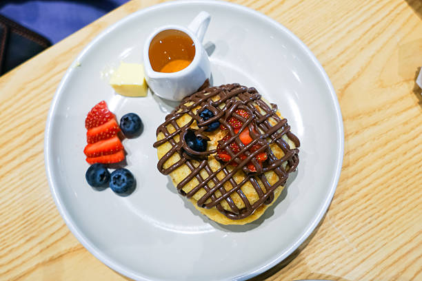A waffle topped with chocolate drizzle