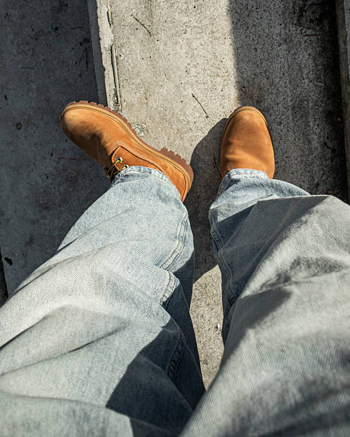 istock Timberlands and jeans on the street 2209735124