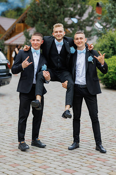 istock Three men in suits are posing for a picture 2209740578