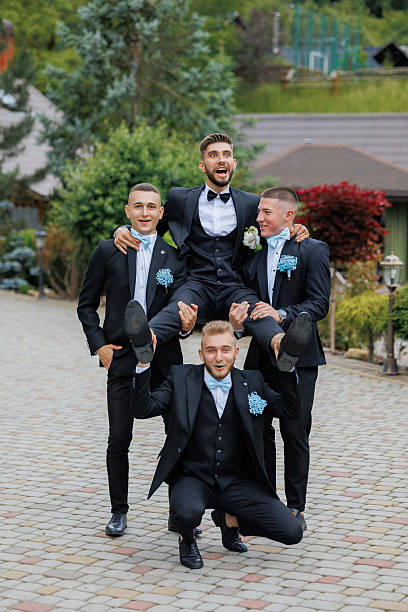 istock Four men in suits are posing for a picture 2209740583