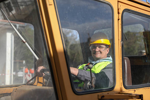 istock Middle-Aged Male Engineer with Yellow Helmet 2209741833