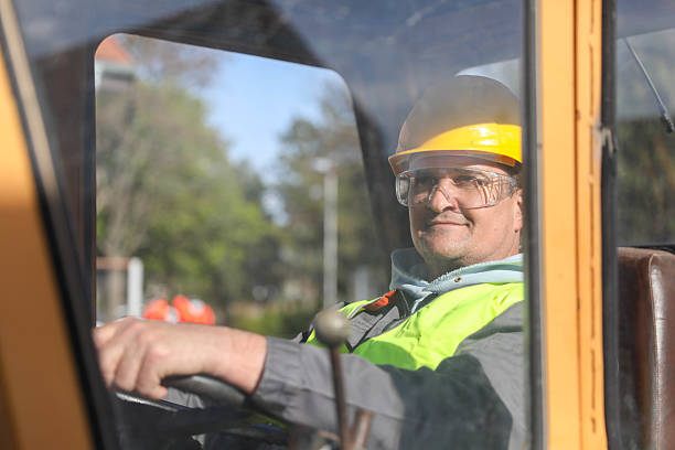 istock Middle-Aged Male Engineer with Yellow Helmet 2209741874