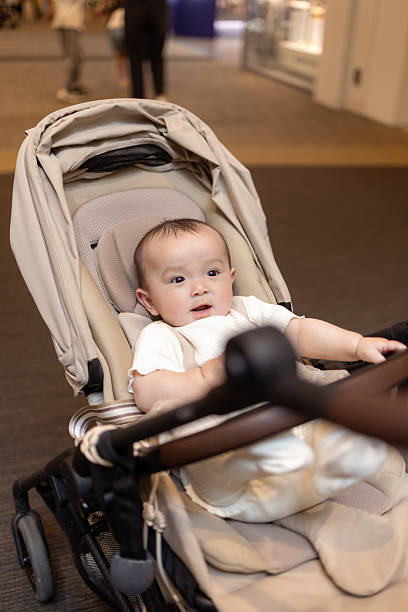 istock Baby in stroller in shopping mall 2209742728