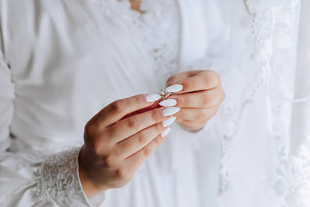 istock A woman is holding a ring in her hand 2209744836