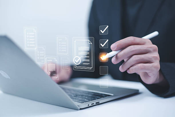 istock Business performance checklist concept, Businessman using laptop take an assessment,An businessman checklist online survey filling form list options business employee security procedures. 2209745627