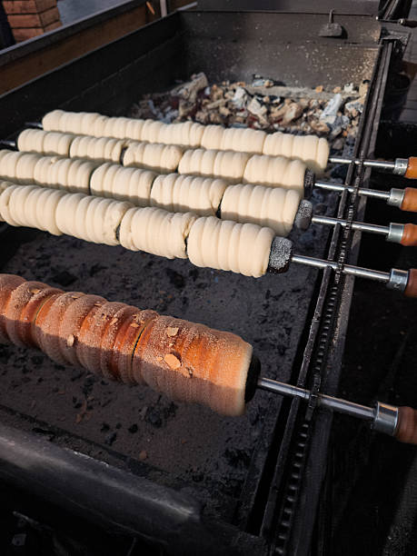 istock Trdelnik baking on charcoal grill in prague old town square 2209745922