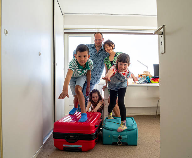 istock Family Packing at Home 2209746712