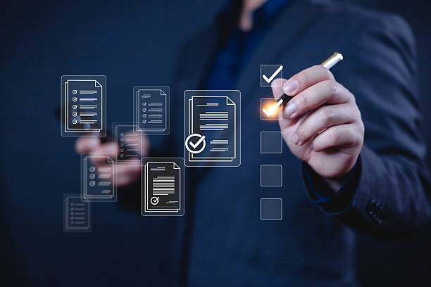 istock Business performance checklist concept, Display a virtual document in front of Businessman, an checklist survey filling form list options business employee security procedures. 2209746853