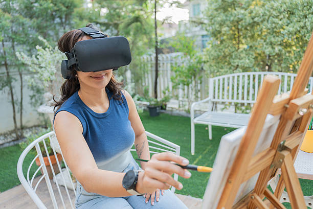 istock Latin Woman Creating Artwork Inspired by Virtual Reality Experience 2209748633
