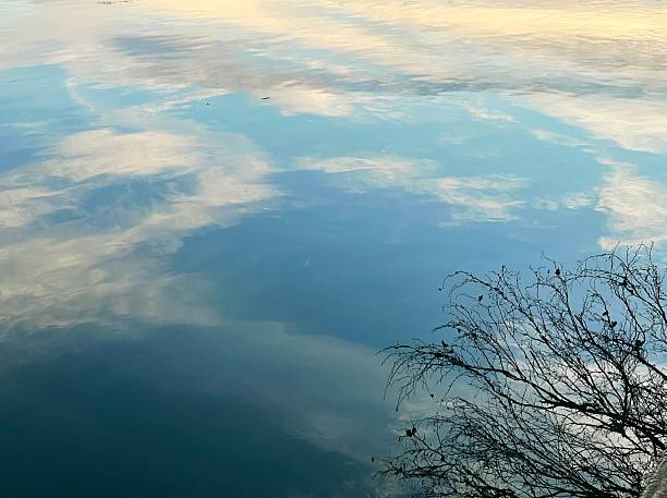 istock Reflection of the sky on the water 2209750504
