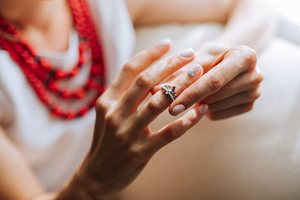 Woman hand a ring of gold silver beauty blur bckground