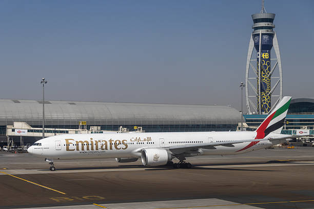 Dubai, United Arab Emirates - April 4, 2025 : Emirates Boeing 777-300ER aircraft at Dubai International Airport in Dubai, United Arab Emirates.
